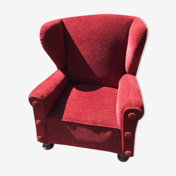 Impressive red velvet eared armchair