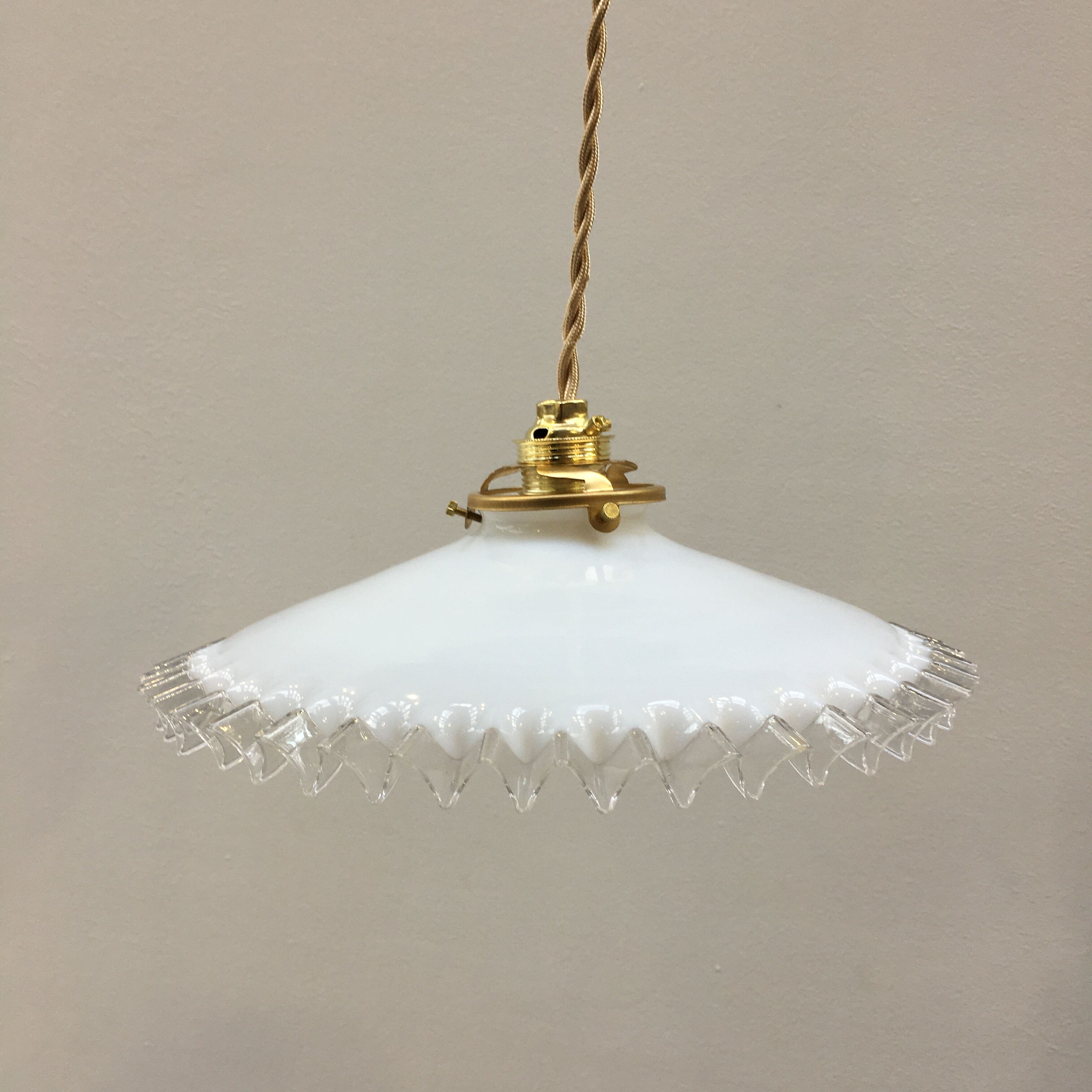 White opaline pendant lamp with transparent serrated edges