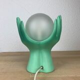 Green ceramic hand lamp and glass globe