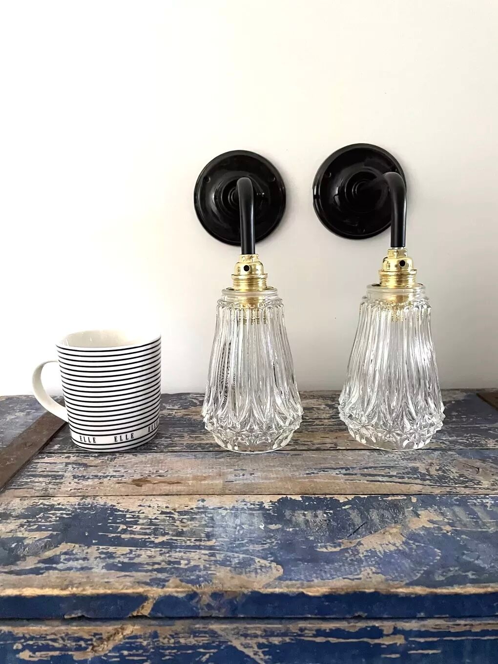 Set of two electrified chiseled glass sconces to nine