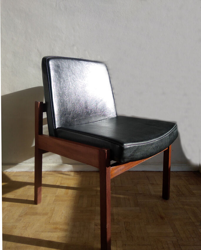 Massive teak and black skai armchair from the 1960s
