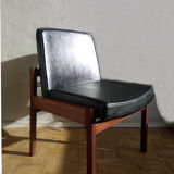 Massive teak and black skai armchair from the 1960s