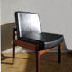 Massive teak and black skai armchair from the 1960s