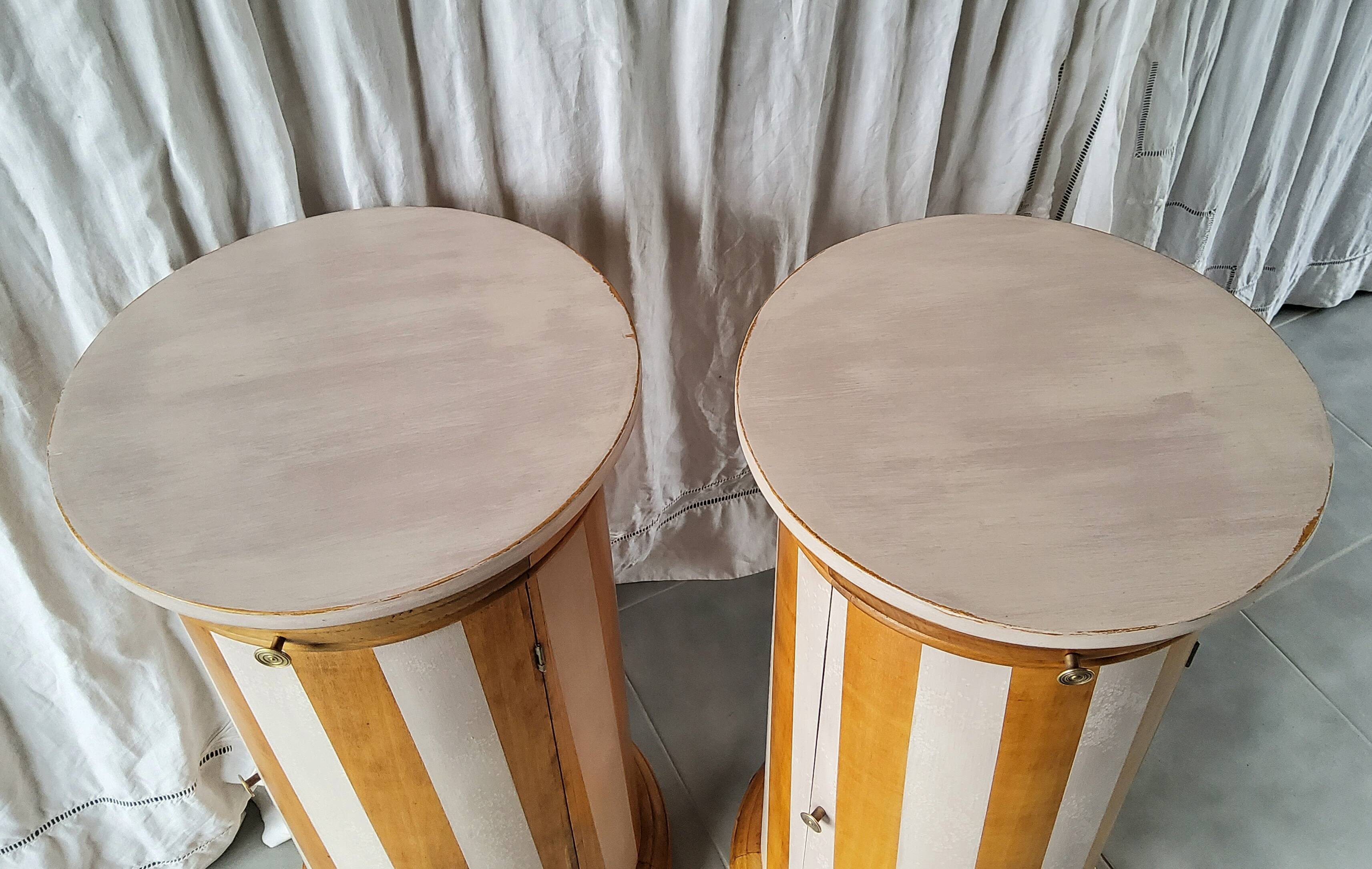 A pair of distressed bedside tables.