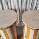 A pair of distressed bedside tables.