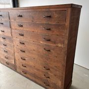 Large wooden workshop cabinet with 16 drawers, antique from the early 1900s.
