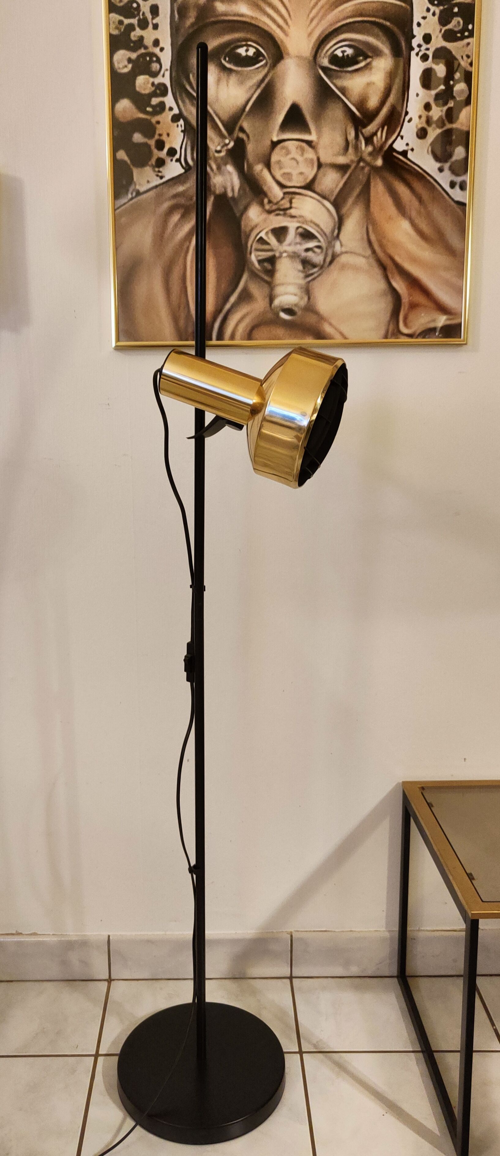 Black floor lamp is gold vintage 1980