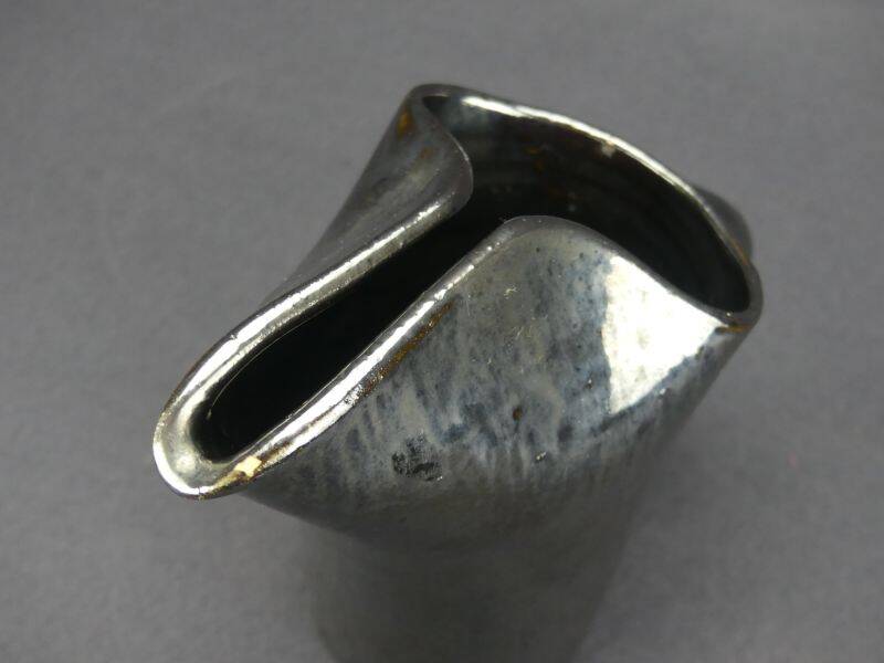 Old Biot, modernist pitcher in iridescent black ceramic.