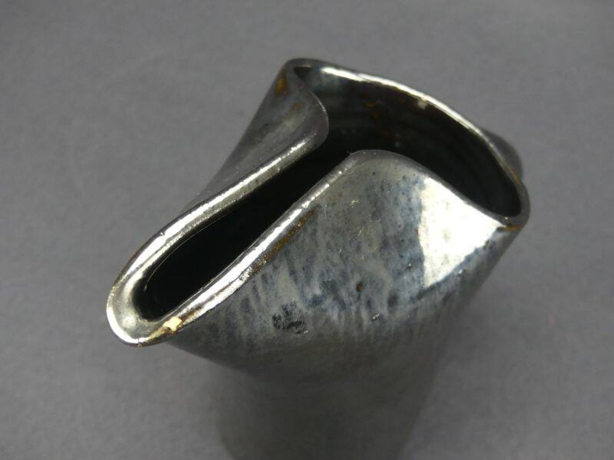 Old Biot, modernist pitcher in iridescent black ceramic.