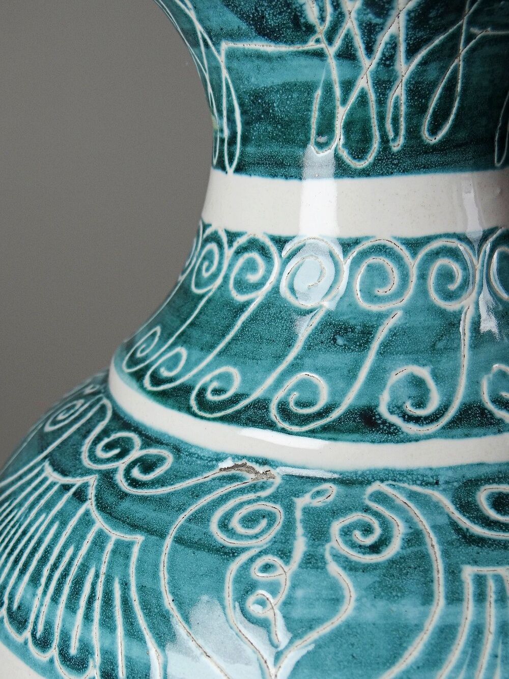 Vintage turquoise ceramic baluster vase with incised decoration.