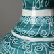 Vintage turquoise ceramic baluster vase with incised decoration.