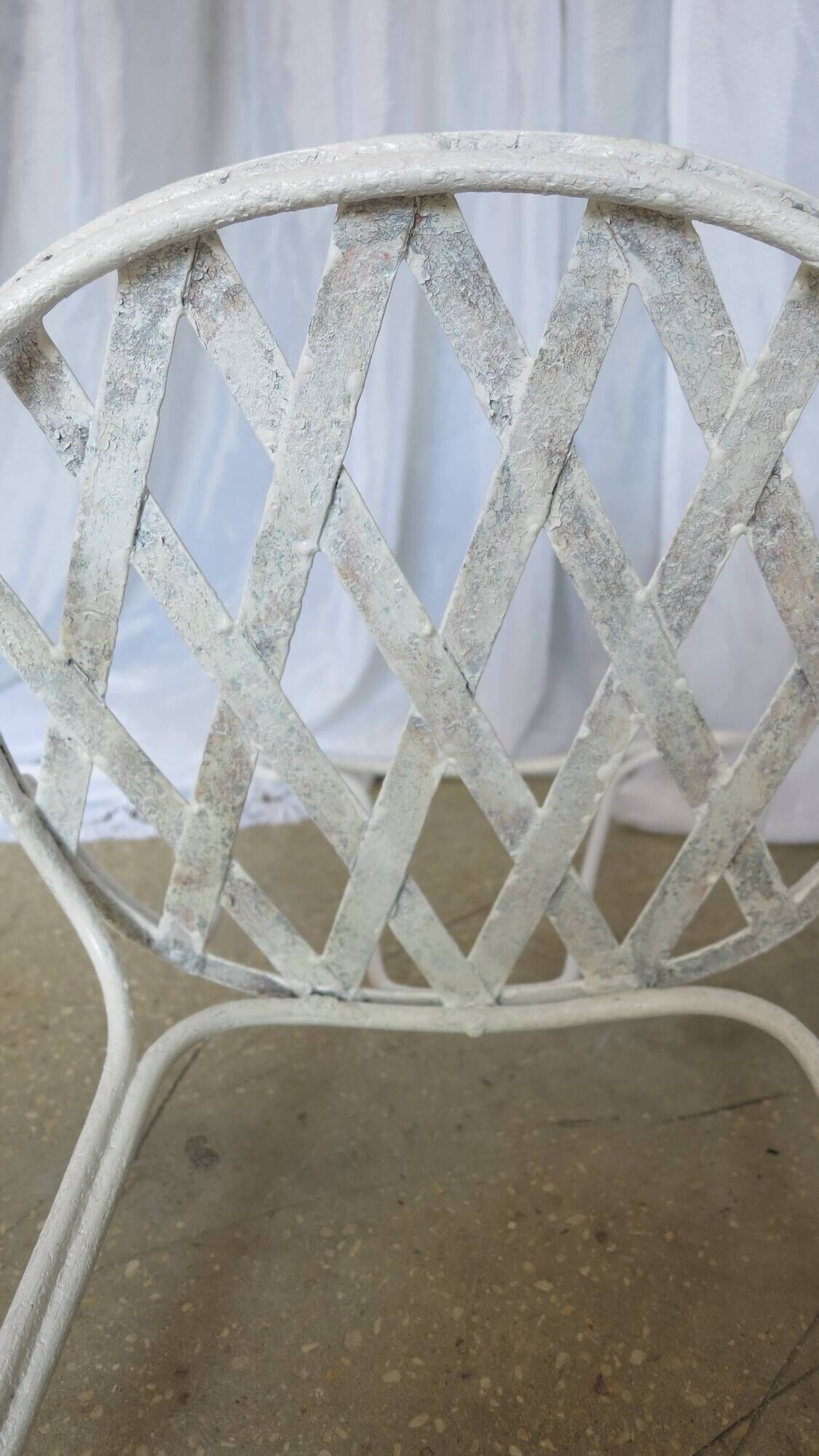 Pair of antique garden chairs, wrought iron, white paint.