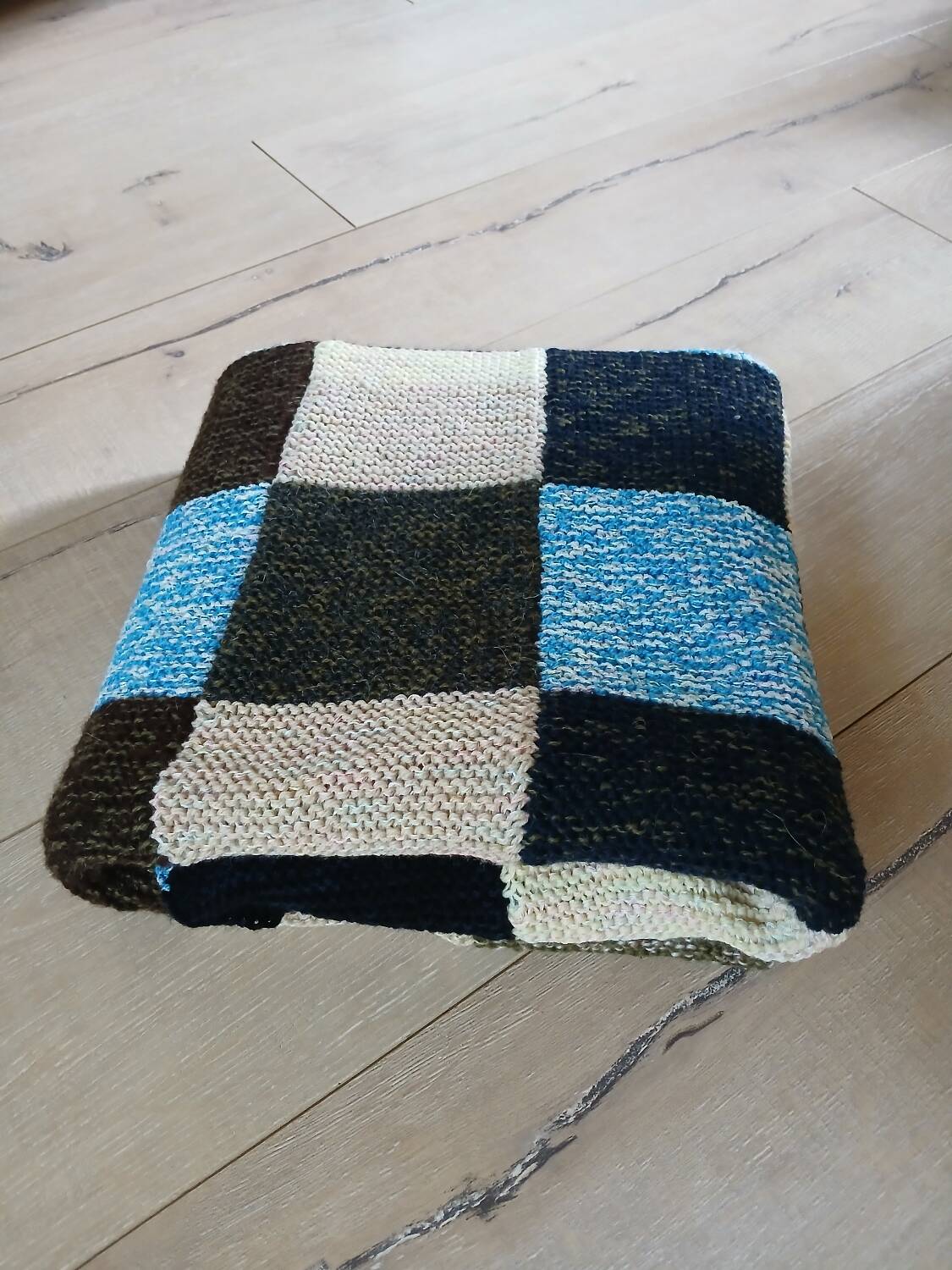 Hand knitted patchwork plaid