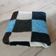 Hand knitted patchwork plaid