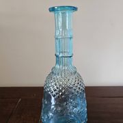 Small vintage turquoise blue glass carafe with floral design.