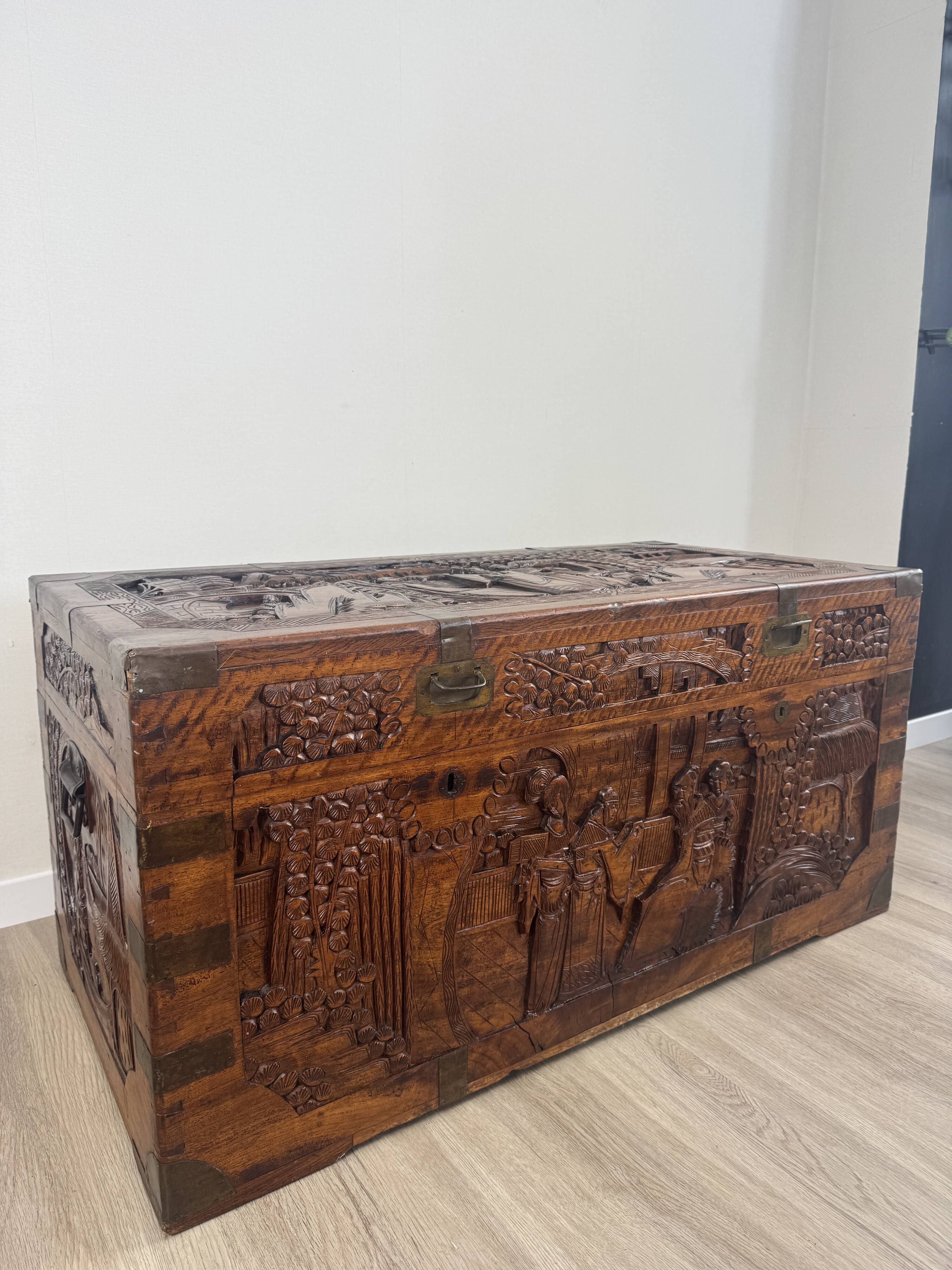 Chinese carved chest made of solid wood — life scenes in bas-relief