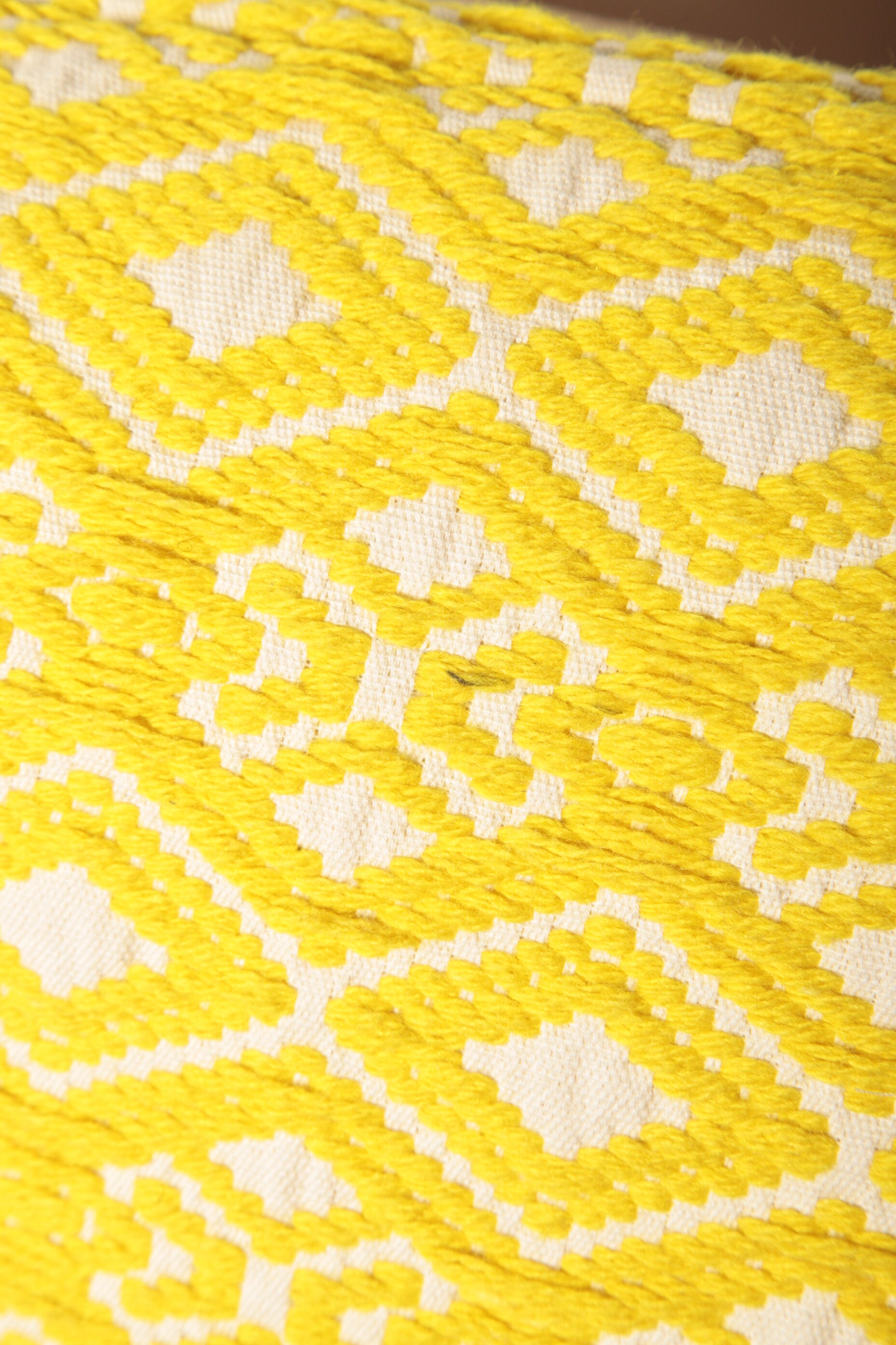 Yellow diamond knit cushion