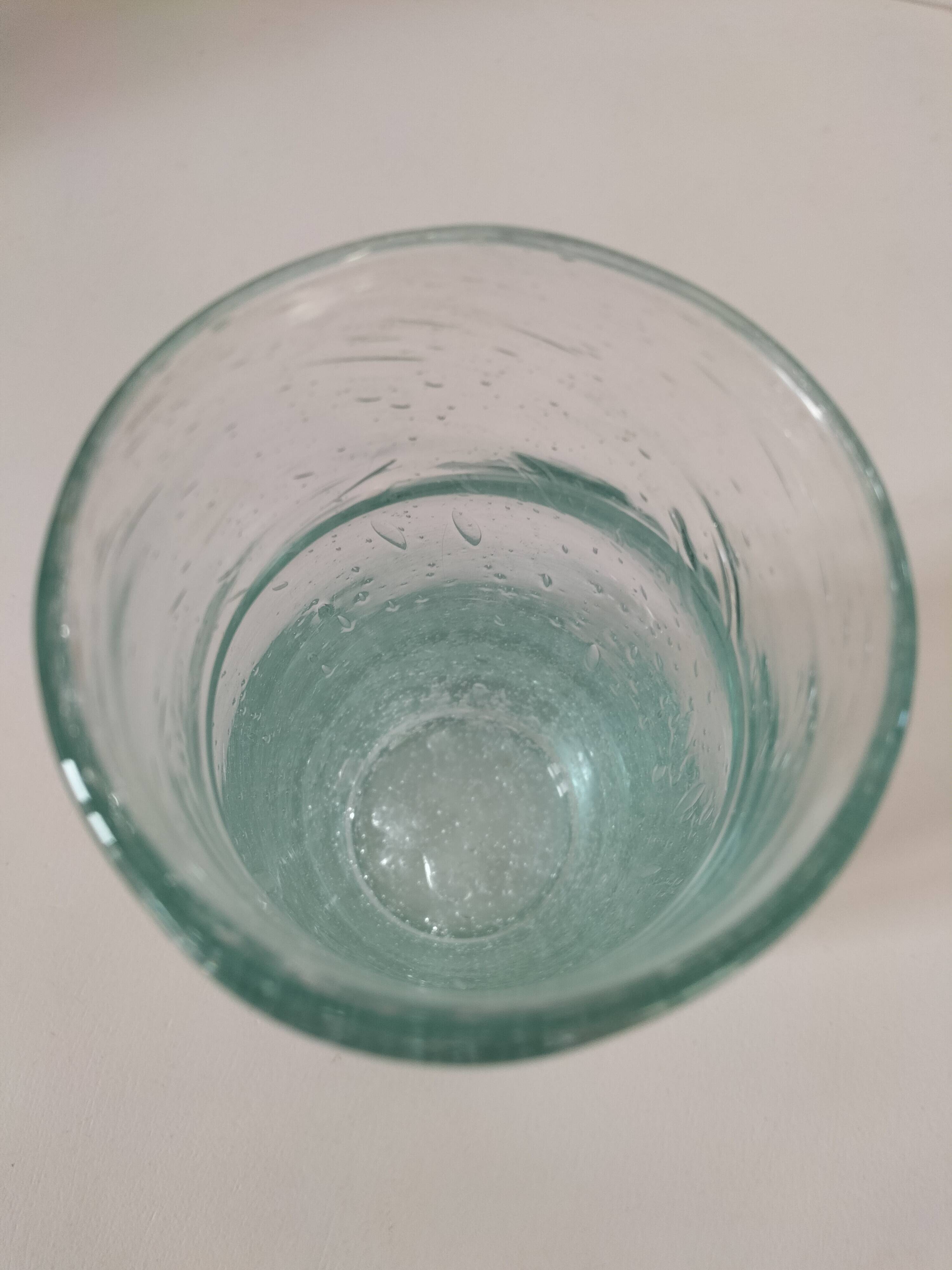 Vintage vase in very pale green bubbled glass, handcrafted