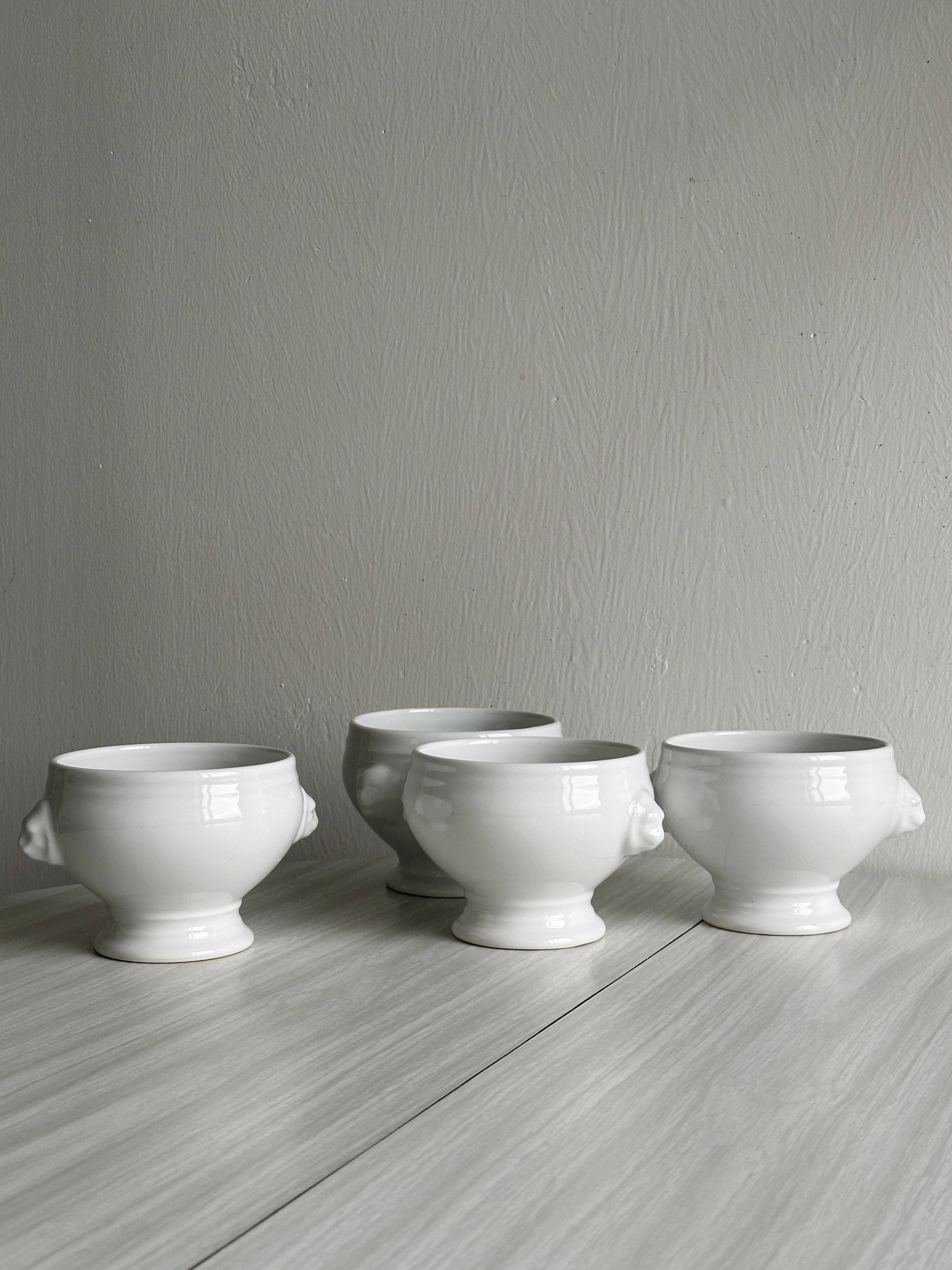 4 white porcelain bowls