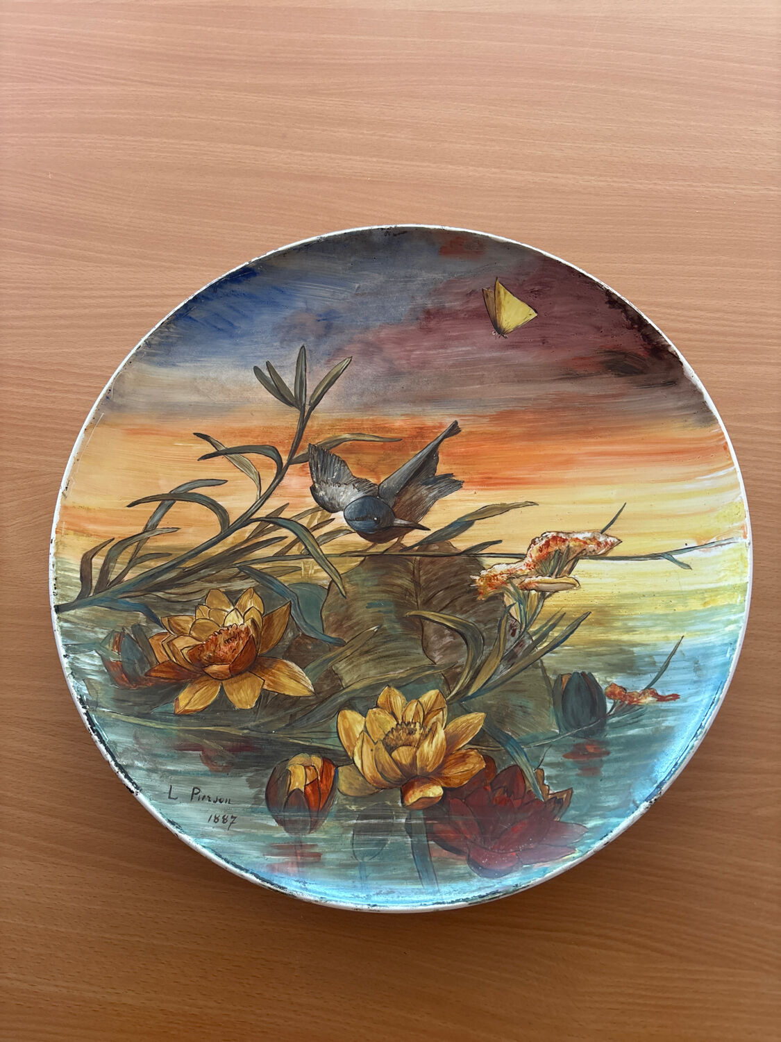 Round plate Montereau painted and signed L Pierson 1887