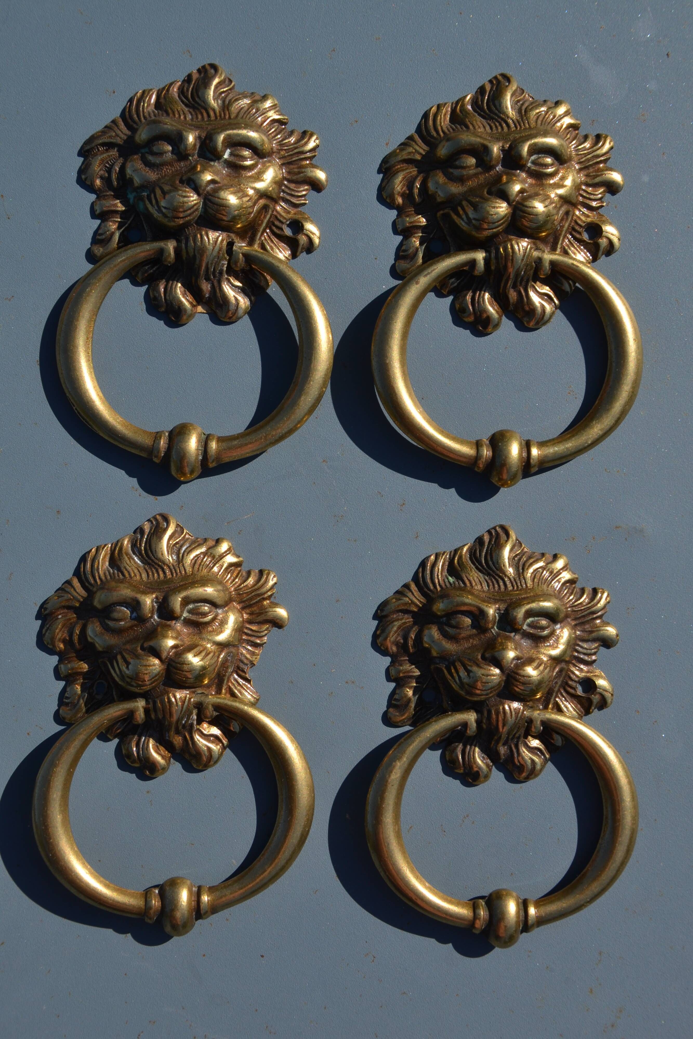 4 antique lion head furniture handles from La Samaritaine.
