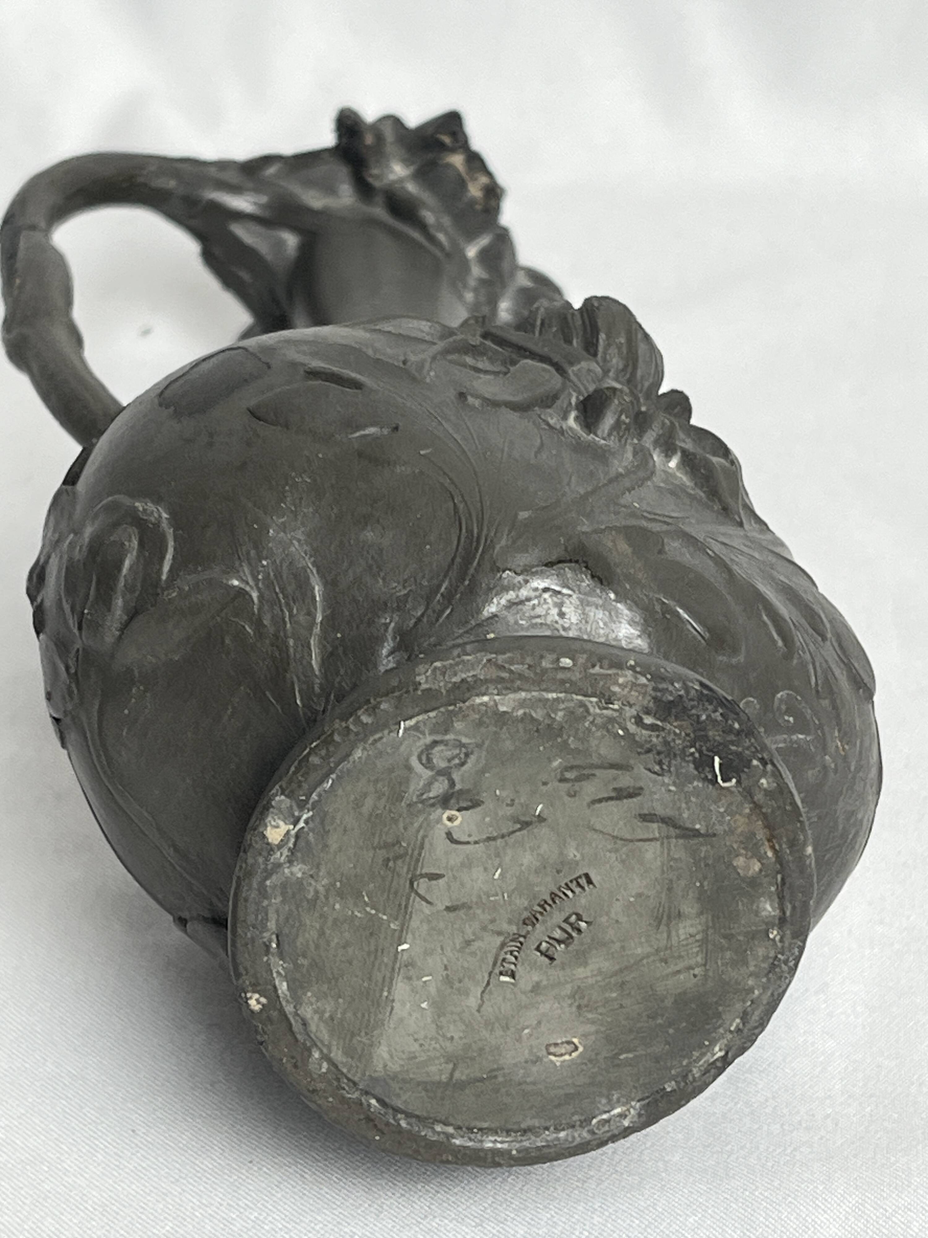 Art Nouveau, a single flower vase jug in pewter signed Petiz around 1900.