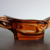 Old empty pocket/swallow ashtray in amber glass