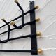 Iron and brass coat rack
