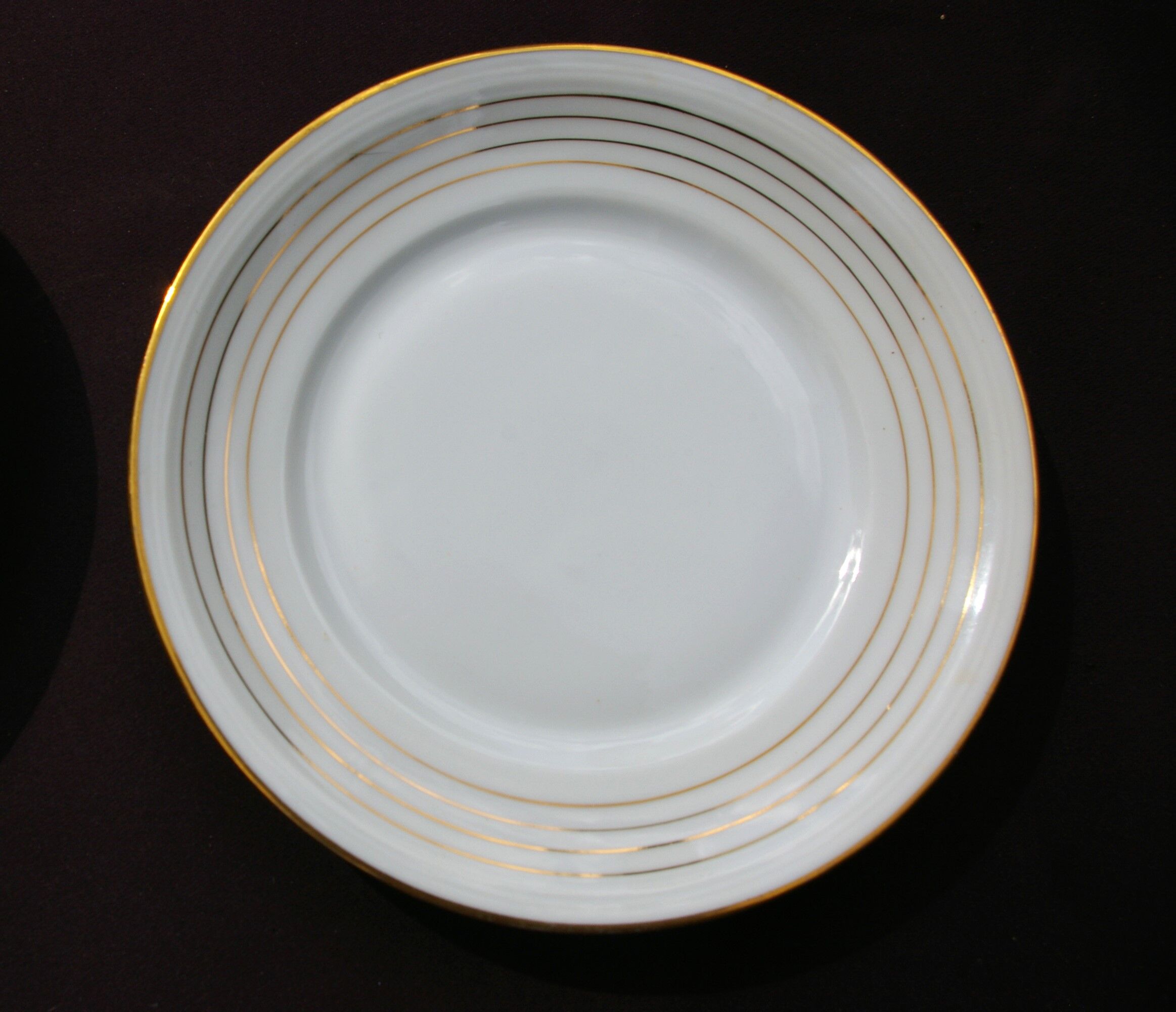 11 Dessert Plates in White Porcelain and Art Deco Gold