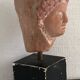 Woman's head in ceramic