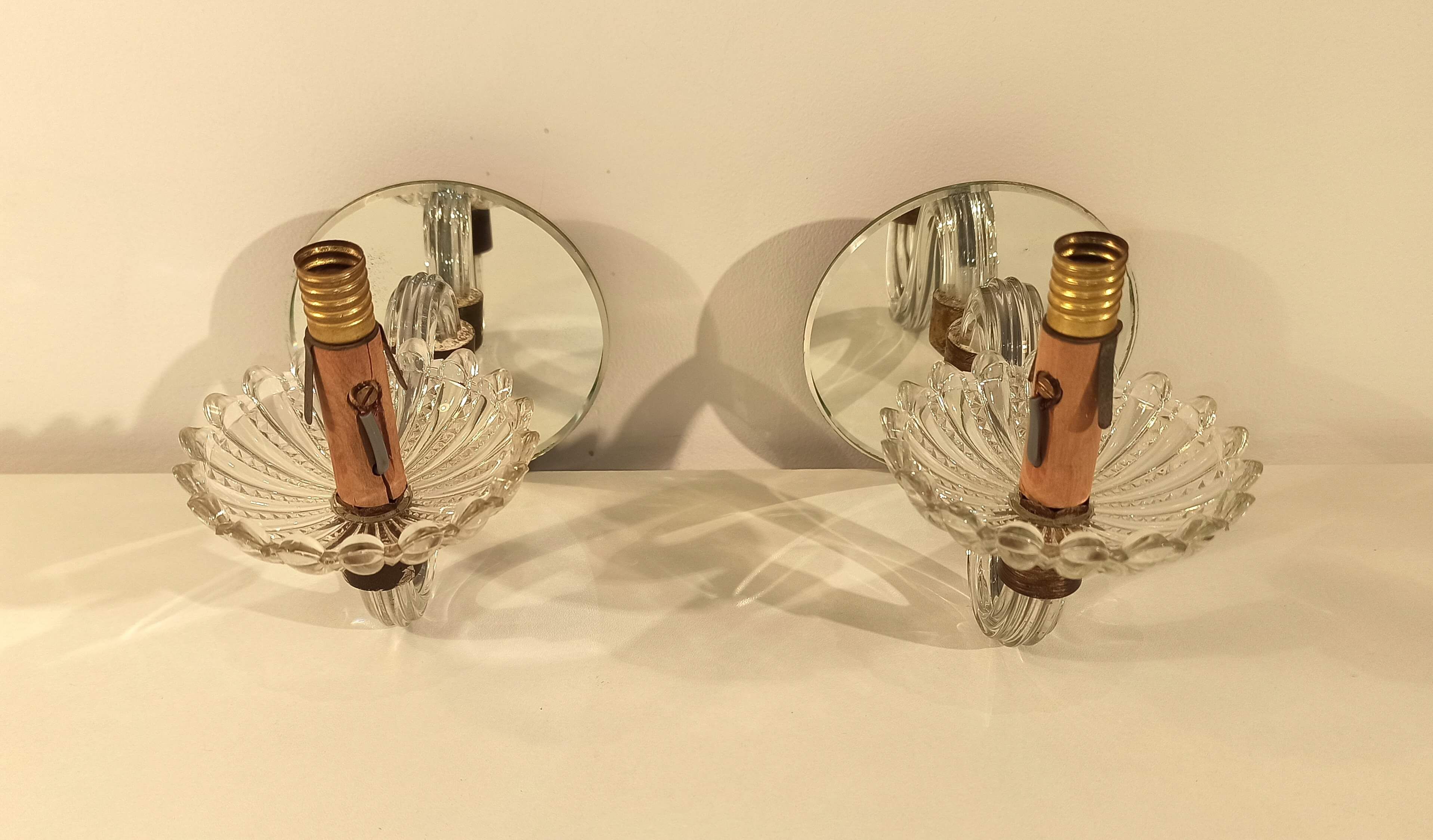 Pair of old glass  wall light and mirror vintage twisted arms