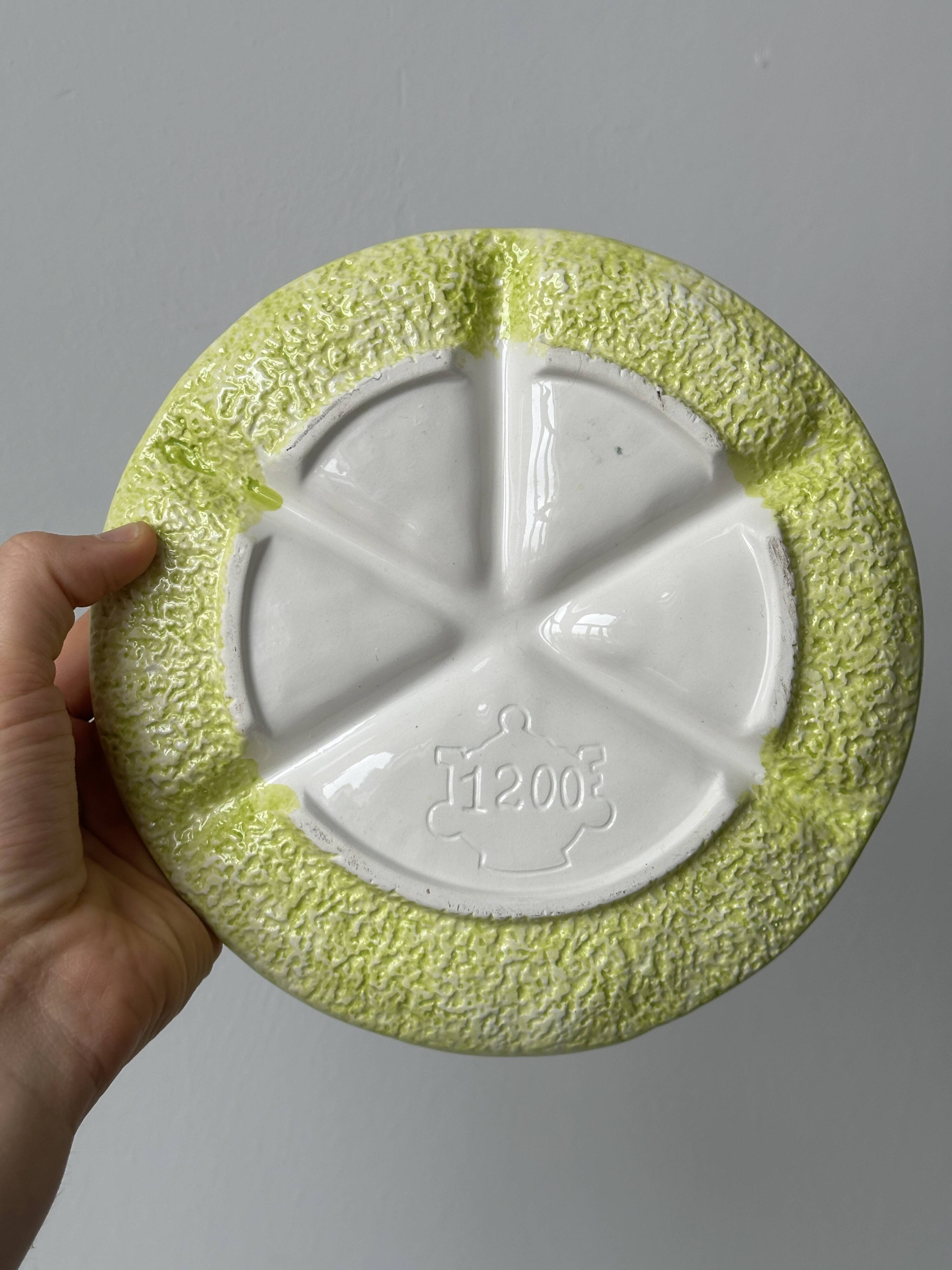 2 ceramic plates depicting a lemon