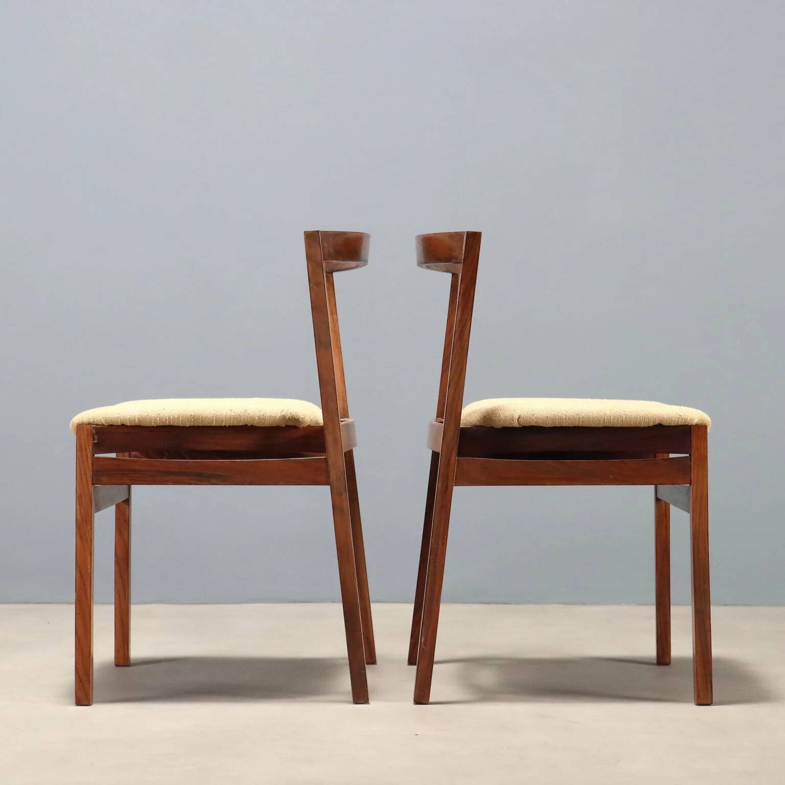 Vintage lounge chairs in exotic wood and fabric, 1960s design.