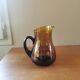 Vintage round pitcher amber glass
