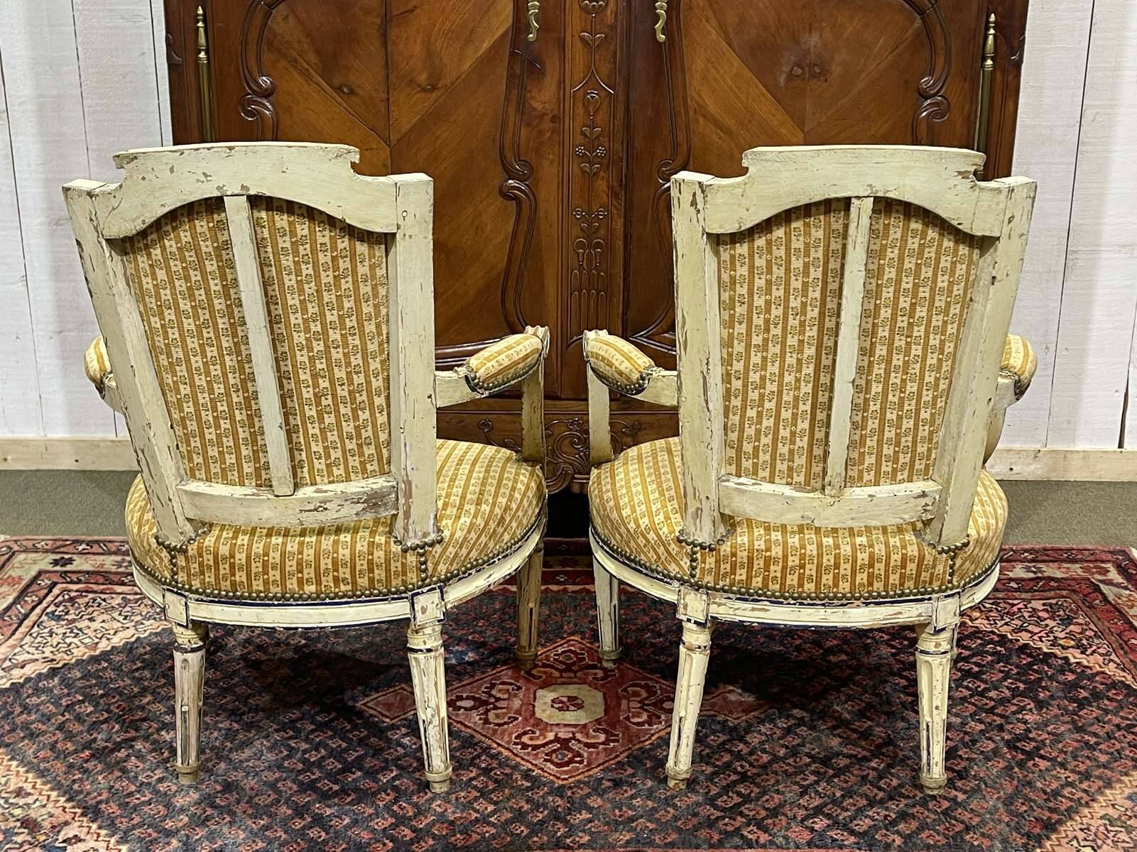 Pair of Louis XVI period cabriolet chairs in beech.