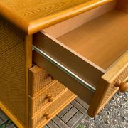 Dresser and its bedside table in rattan caning and vintage oak from the 1970s.