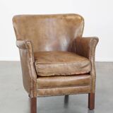Fauteuil en cuir subtil avec coussin d'assise réversible en kilim