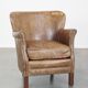 Fauteuil en cuir subtil avec coussin d'assise réversible en kilim