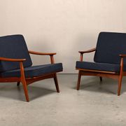 Pair Scandinavian Modern armchairs in teak and dark blue bouclé fabric