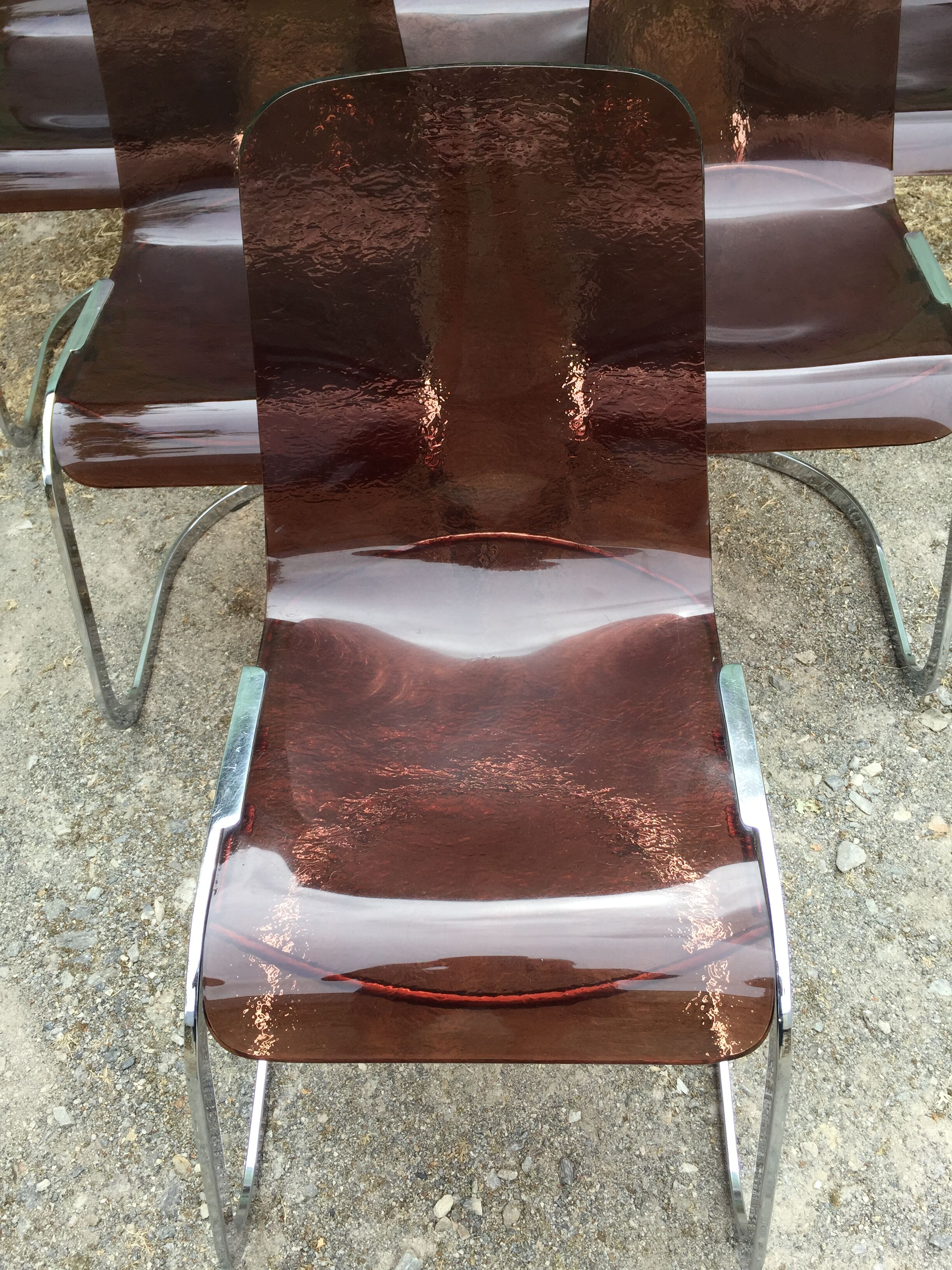 Chairs in plexiglas with chrome metal base
