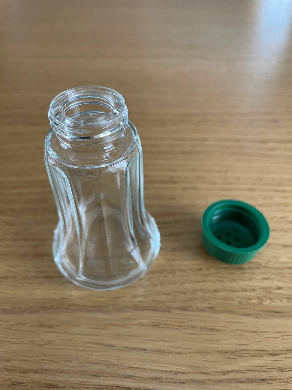 Vintage salt shaker with green Bakelite cap