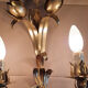 Gold sconces with floral decoration