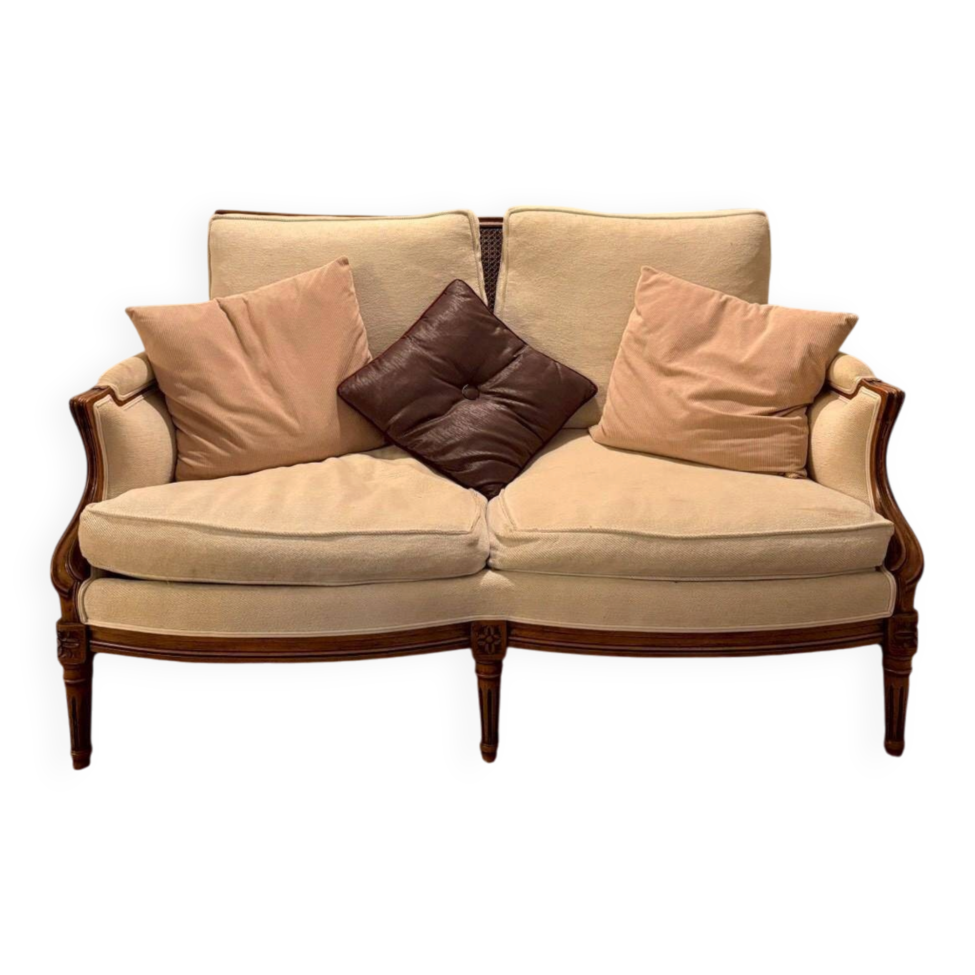 Two-seater canapé by Roche Bobois in Louis XVI style — carved wood, caned sides.