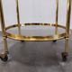 Hollywood Regency bar cart in bronze and smoked glass, 1950s