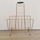 Vintage magazine rack in gold metal