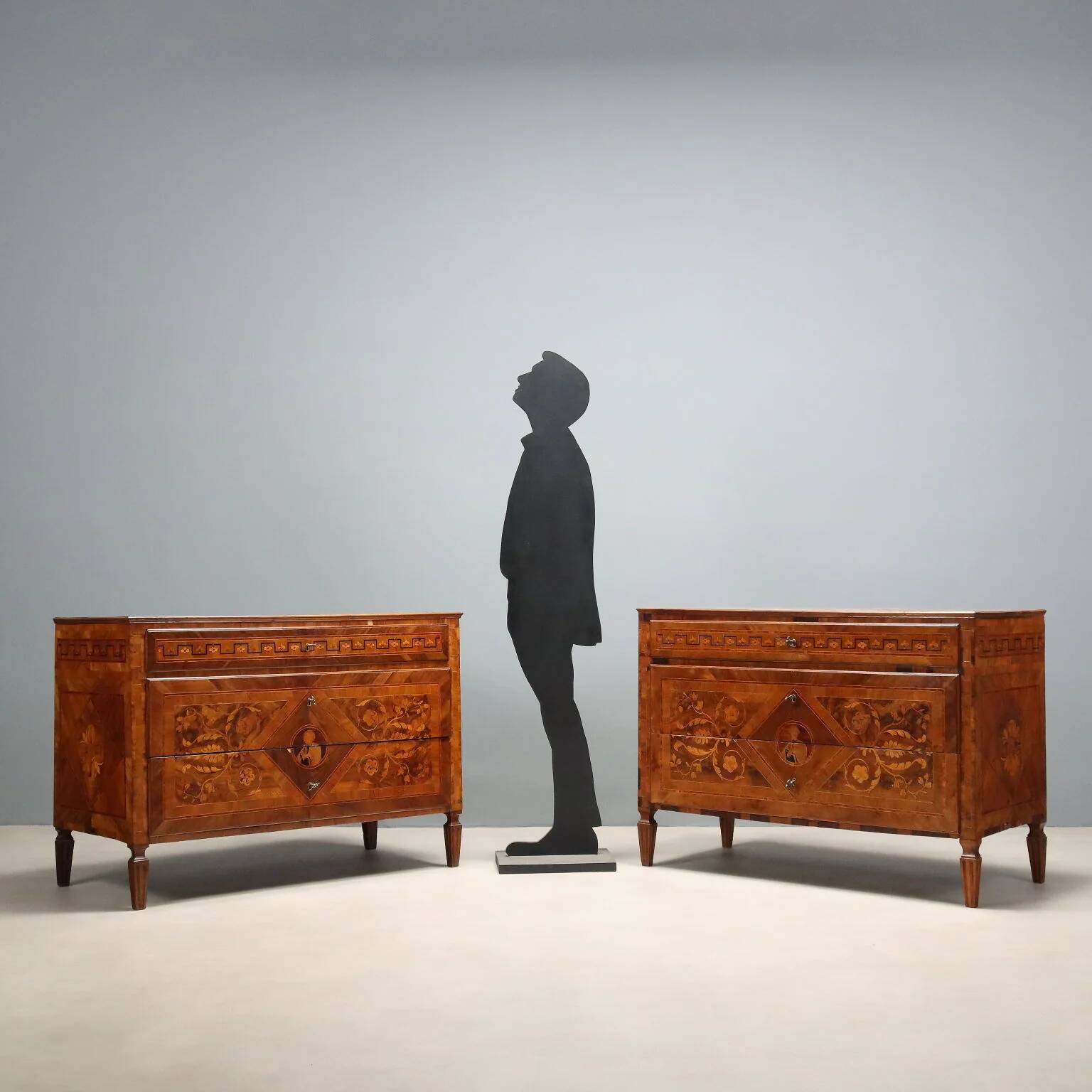 Pair of antique neoclassical walnut commodes from the 18th century.