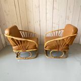 Pair of leather and bamboo armchairs