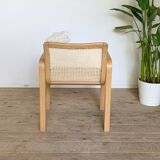 Vintage armchair in caning