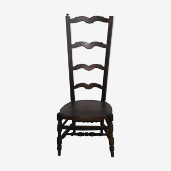 Low chair with high back called fire corner chair or nanny chair