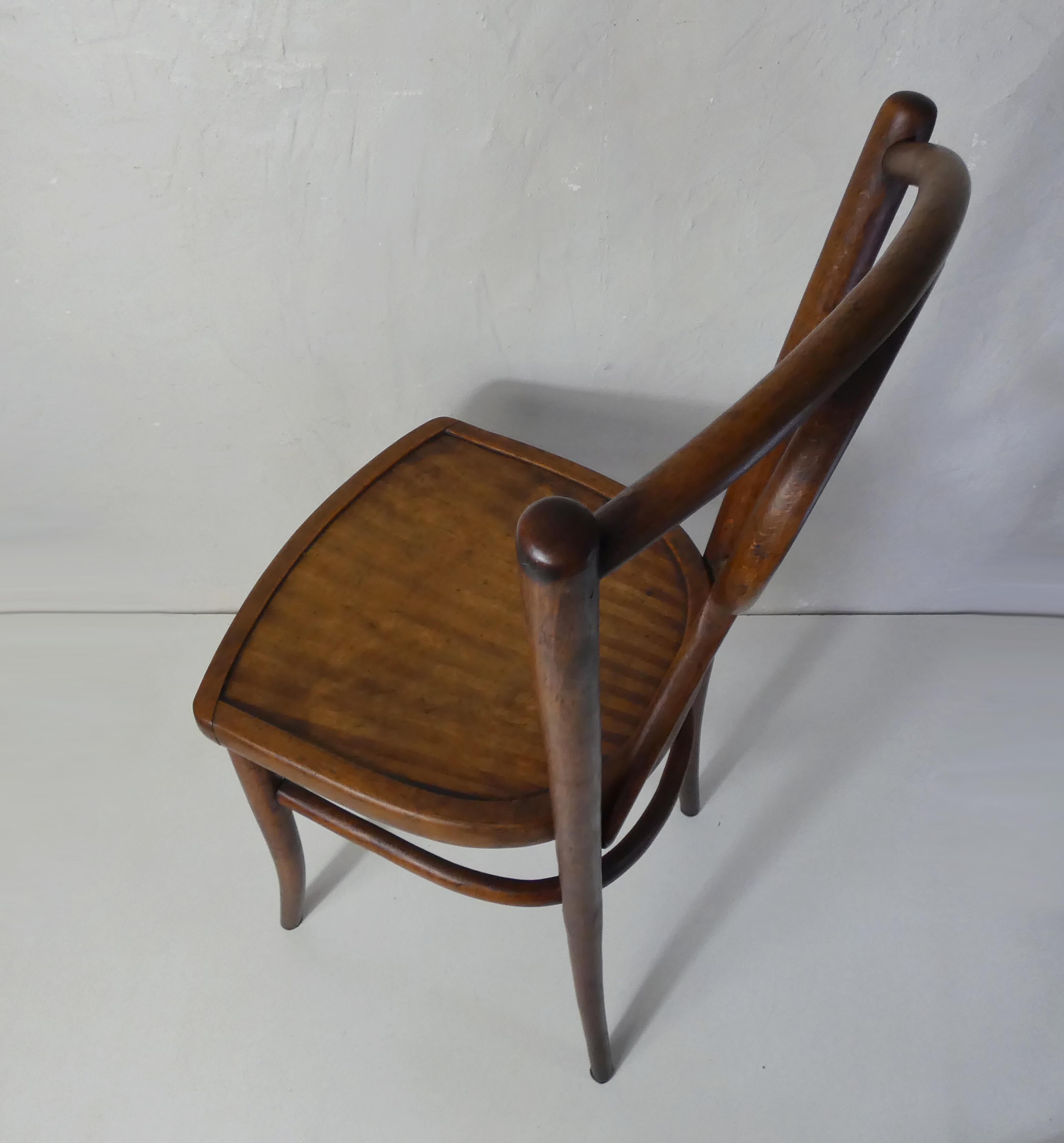 Old curved wooden bistro chair
